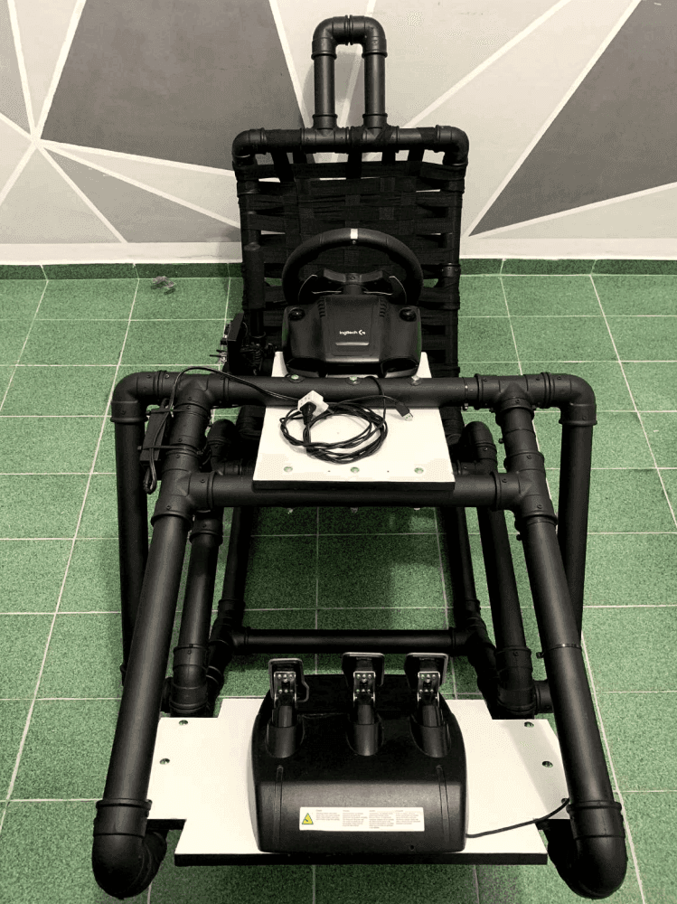 Front view of the cockpit showing the pedal plate, wheel deck, and woven strap seat