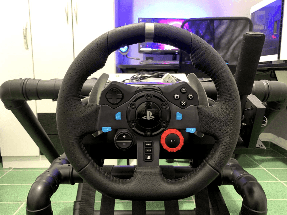 Driver point of view: Logitech G29 racing wheel mounted on the cockpit in front of the gaming PC